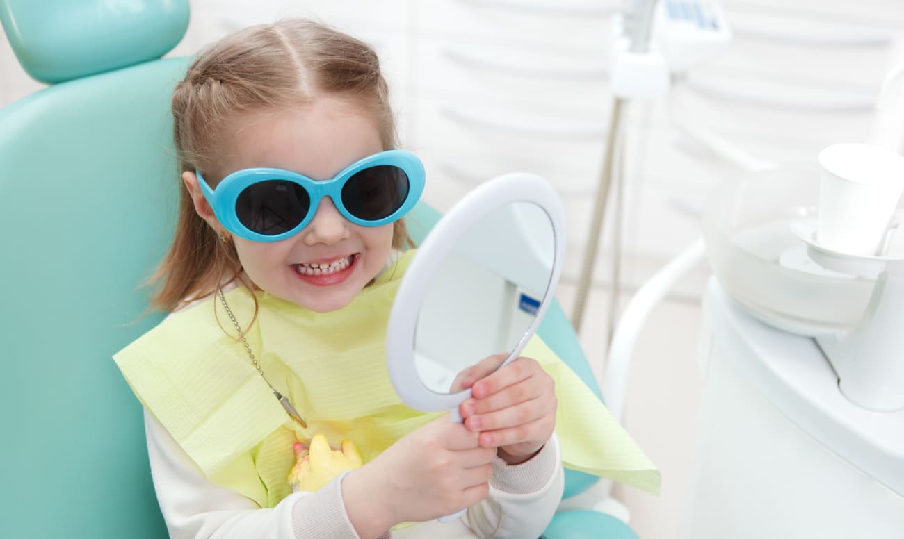 Фото ребенка в кресле стоматолога