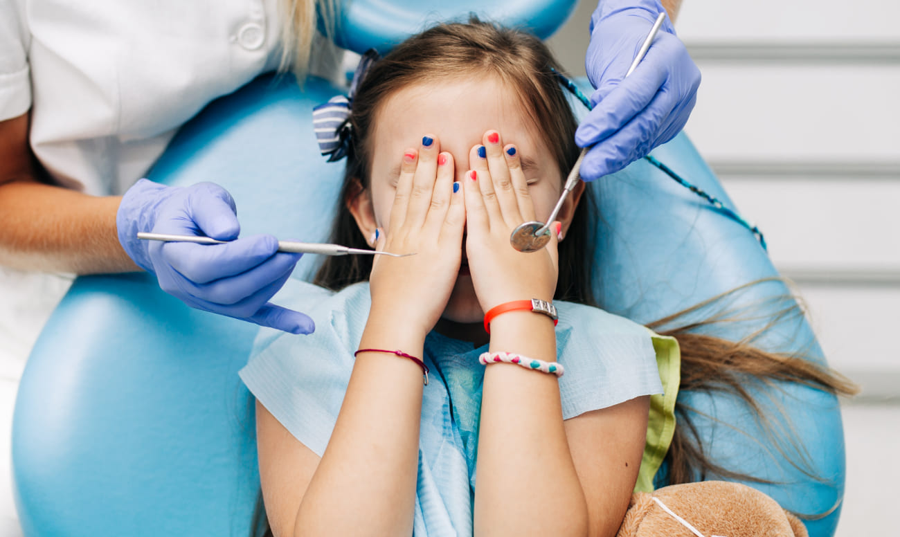 Фото ребенка испытывающего страх на приеме у стоматолога