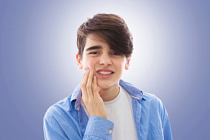 Болят зубы после брекетов — что делать?