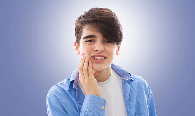 Болят зубы после брекетов — что делать?